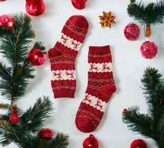 Red Christmas socks with playful reindeer and detailed snowflake accents, ideal for spreading holiday cheer and keeping feet warm.