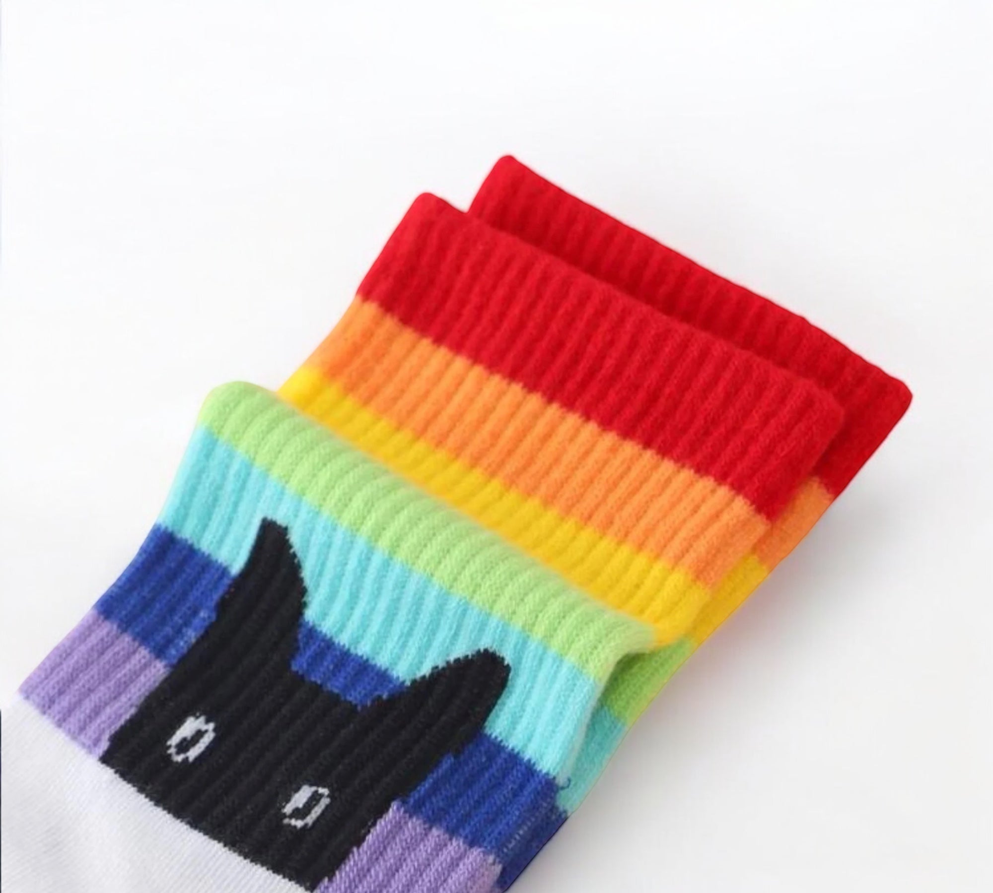 Close-up of white Peeking Cat Rainbow Pride Socks featuring a black cat peeking design and rainbow colors.