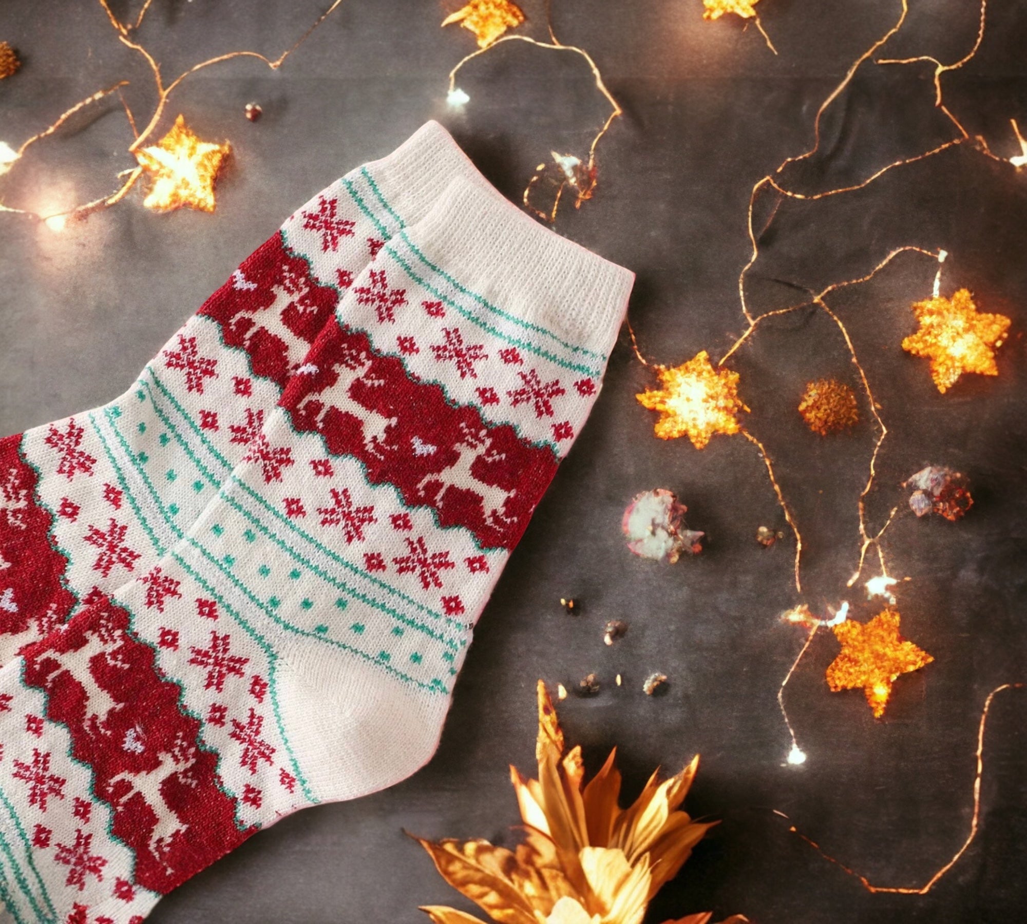 Single festive Christmas sock surrounded by warm string lights and holiday decor, highlighting cozy red and beige patterns with reindeer and snowflakes.