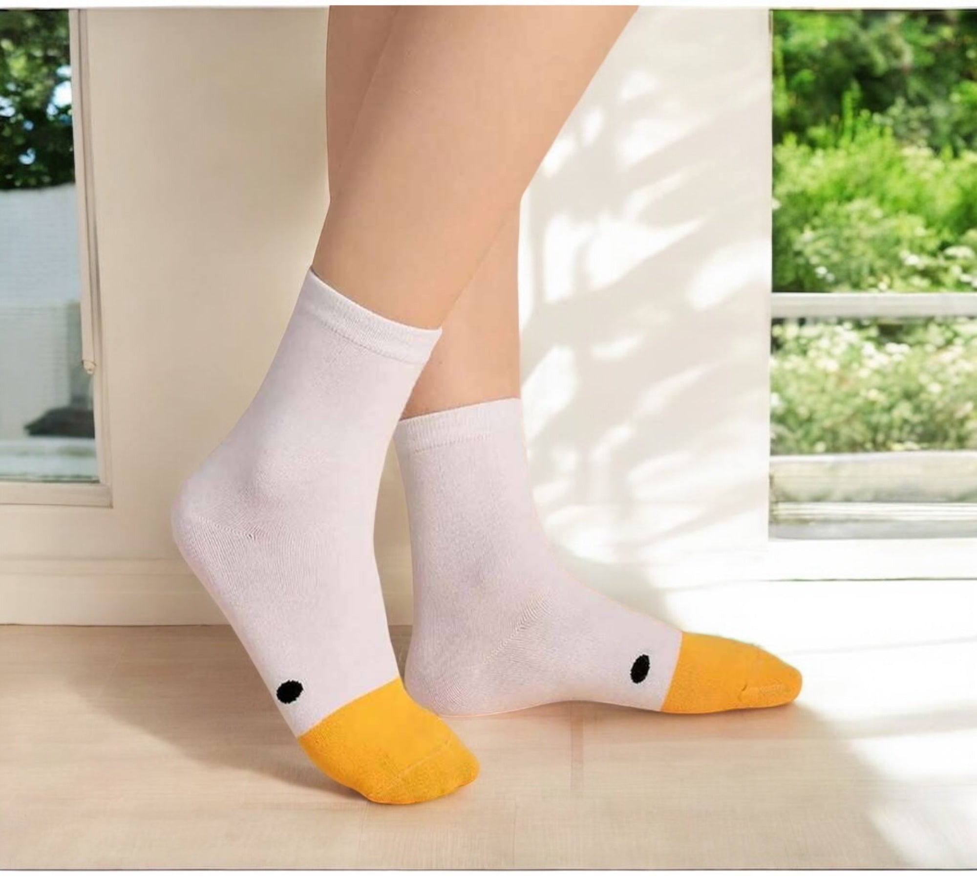 Yellow and White Silly Goose Socks worn on feet, perfect for everyday wear or gifting.
